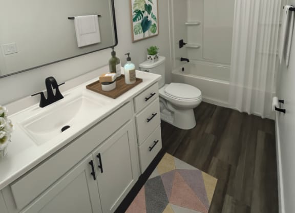 Remodeled bathroom with a white sink and toilet and a shower  at Ivy Hills Living Spaces, Cincinnati, OH