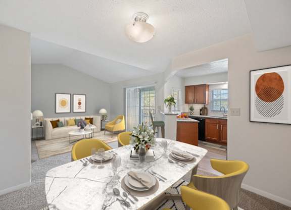 a living room and dining room with a marble table and chairs at Normandy Club Apartments, Centerville, Ohio