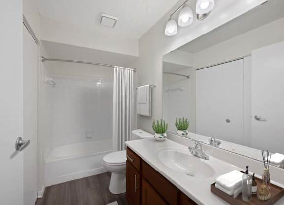 a bathroom with a sink and a shower and a toilet at Normandy Club Apartments, Centerville, 45459