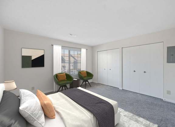a bedroom with a bed and two chairs at Normandy Club Apartments, Centerville, OH