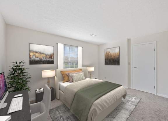 a bedroom with a bed and a desk at Normandy Club Apartments, Centerville