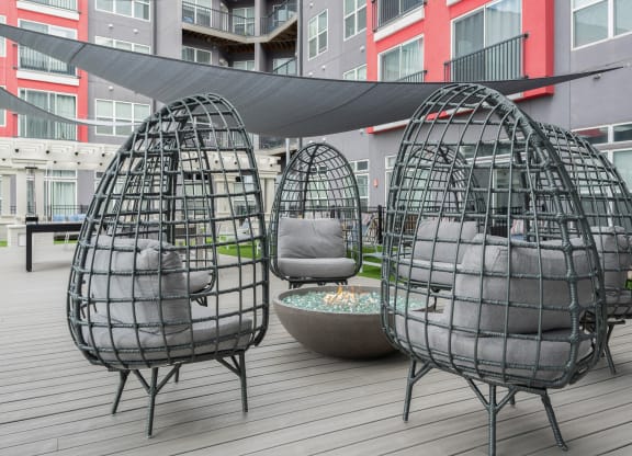 a set of three geodesic egg chairs on a patio