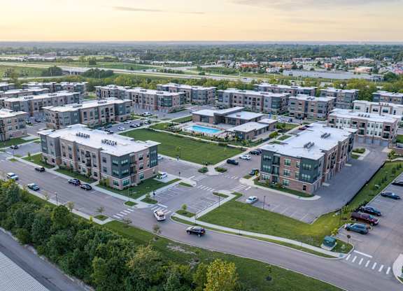 A large apartment complex with multiple buildings and parking lots.
