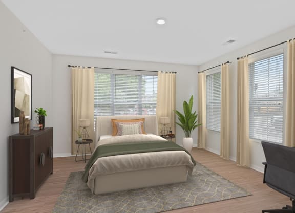 a bedroom with a bed and a desk and windows at Monmouth Row Apartments, Kentucky