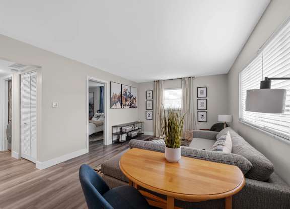 Living room with a wooden table at The Rand Apartments, Columbus, OH, 43227