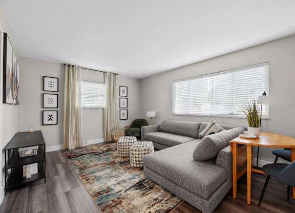 Living room with a grey couch at The Rand Apartments, Columbus