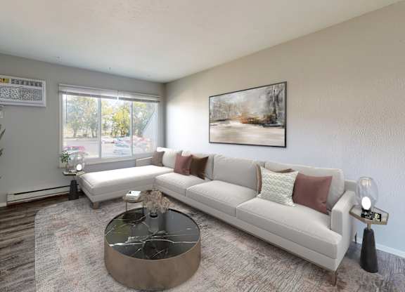 A living room with a white couch and a coffee table.