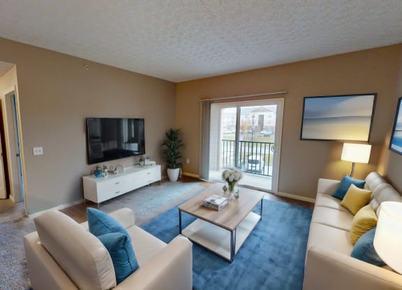 a living room with a couch and a table and a television