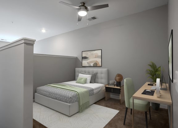 a bedroom with a bed and a desk and a ceiling fan at Adelphi Quarter, Columbus