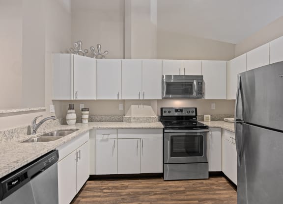 Wooden floor kitchen with cabinets at The Lofts at Shillito Place, Cincinnati