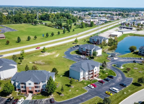 an aerial view of a neighborhood with houses and a parking lot