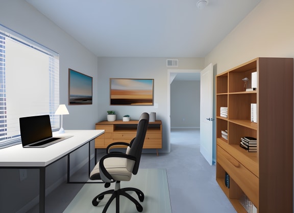 a home office with a computer and a desk