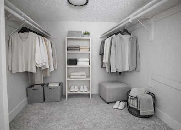 A black and white photo of a small, tidy closet.