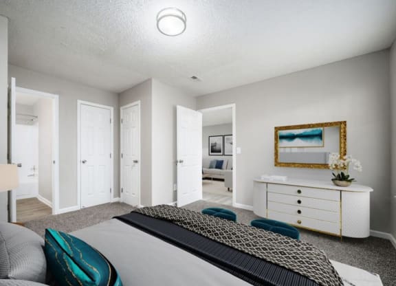 a bedroom with a bed and a dresser at The Berryessa Apartments, Ohio
