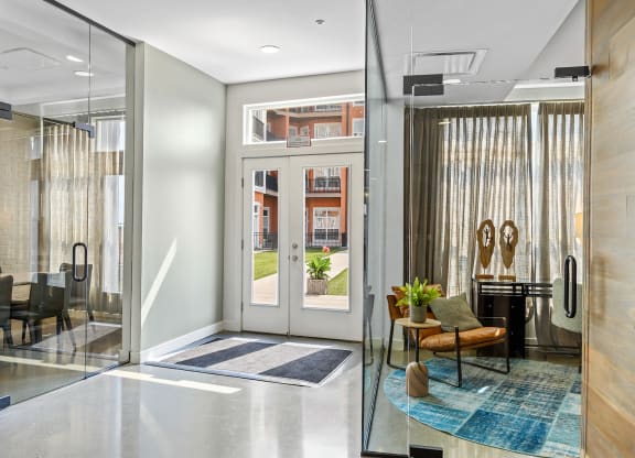 Three-Bedroom Apartments in West Chester, OH - Liberty Center - Lobby with Glass Doors, Waiting Area, and Window Drapes