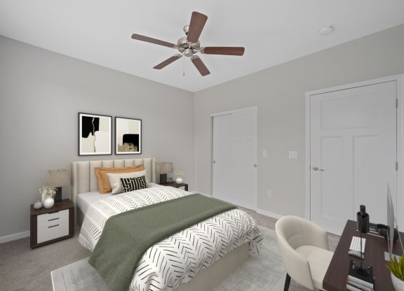 a bedroom with a large bed and a ceiling fan at Monmouth Row Apartments, Newport, KY