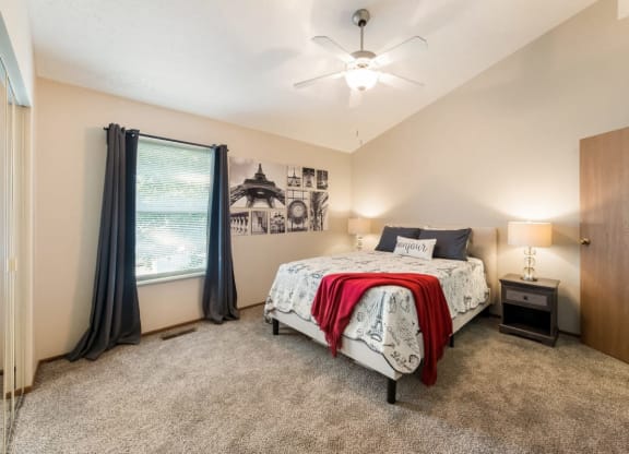 a bedroom with a bed and a ceiling fan at Parkside at Maple Canyon Apartments, Columbus, OH 43229