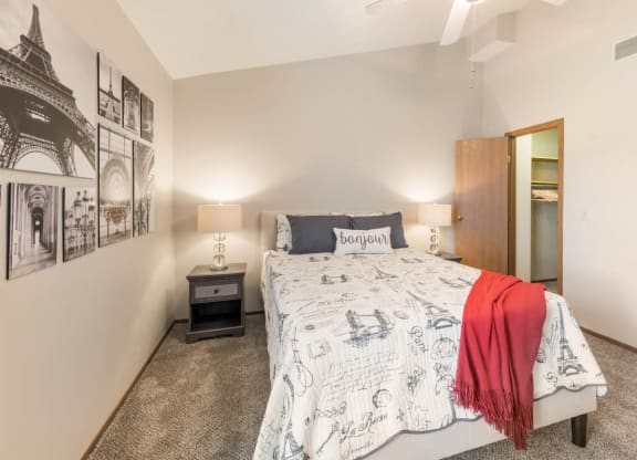 a bedroom with a bed and a closet at Parkside at Maple Canyon Apartments, Ohio, 43229