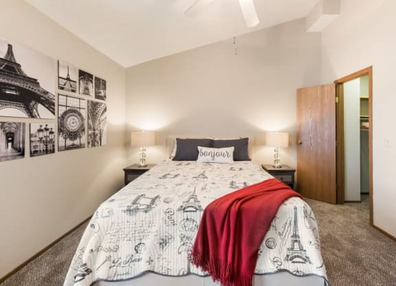 a bedroom with a bed and a closet at Parkside at Maple Canyon Apartments, Ohio