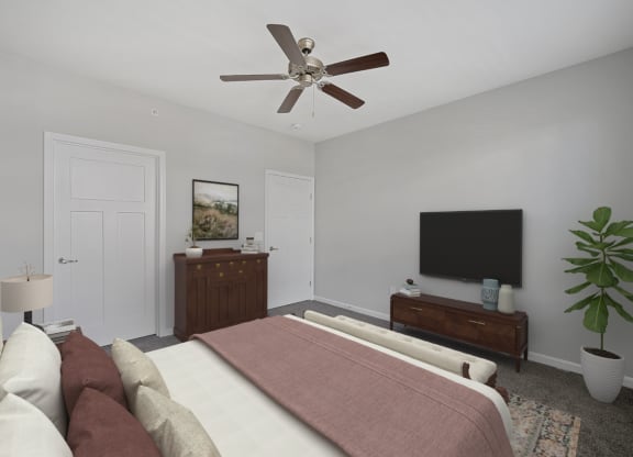 a bedroom with a large bed and a ceiling fan at Monmouth Row Apartments, Newport, KY