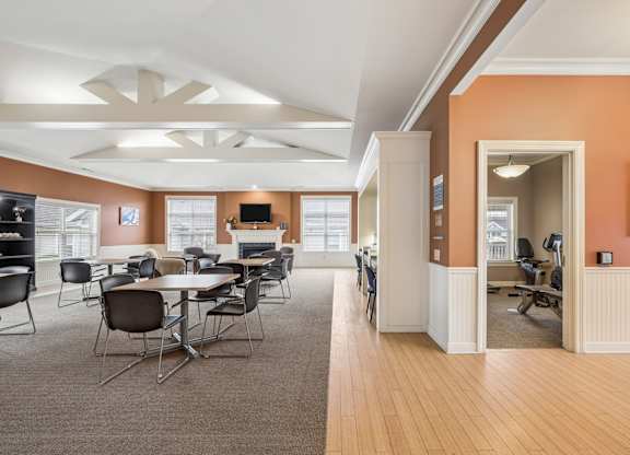 A conference room with a long table and chairs.
