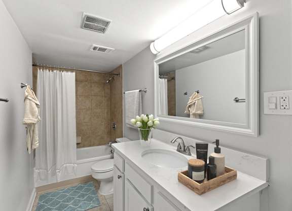 a bathroom with a sink and a mirror and a shower at Merrick Place, Lexington, 40502