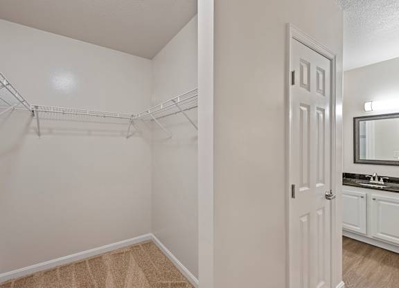 an empty bedroom with a closet and a bathroom at Roebling Row, Kentucky