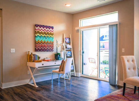 a home office with a desk and sliding glass doors at DeSales Flats Apartments*, Cincinnati, Ohio