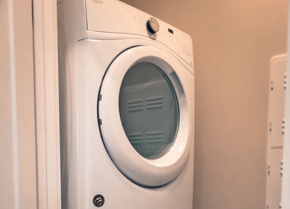 a small laundry room with a washer and dryer at DeSales Flats Apartments*, Ohio