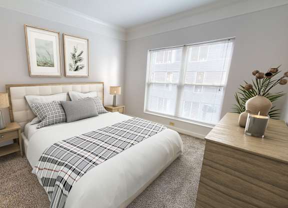 a bedroom with a bed and two windows