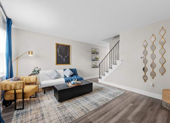 Living room with a staircase at The Rand Apartments, Ohio, 43227