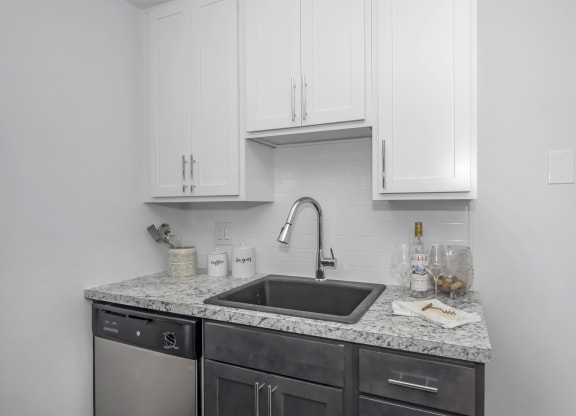 Kitchen with white cabinets and a sink and a counter top at Tall Timber Apartments, Cincinnati, OH, 45241