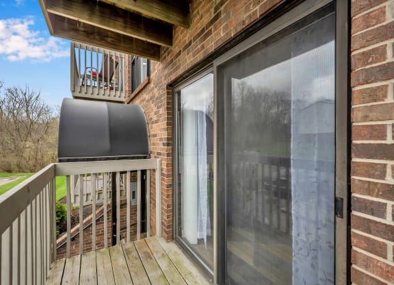 Deck has a large sliding glass door to the patio at Tall Timber Apartments, Cincinnati, OH