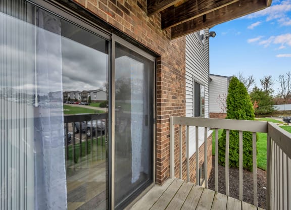 Deck of a home with a sliding glass door at Tall Timber Apartments, Cincinnati, OH, 45241
