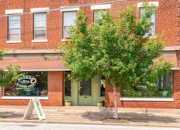A tree in front of a building at The Ridge Apartments, Cincinnati, OH