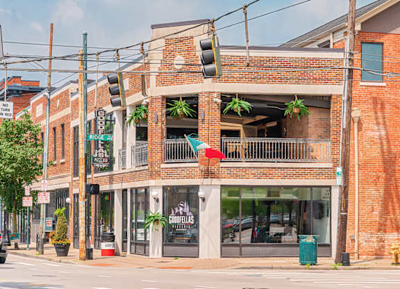 A street view of a building with a sign at The Ridge Apartments, Ohio