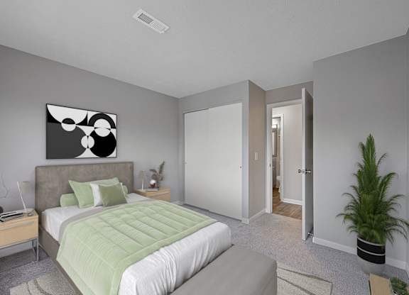 A bedroom with a bed, nightstand, and a painting on the wall at The Reserve at Grand Valley Apartments, Milford, Ohio