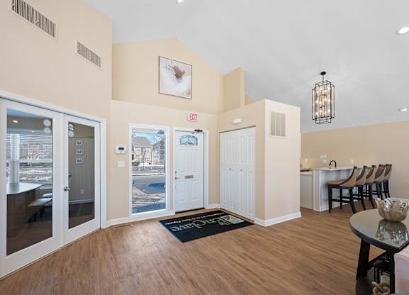 A room with a table and chairs and a view of a city at Enclave, Beavercreek