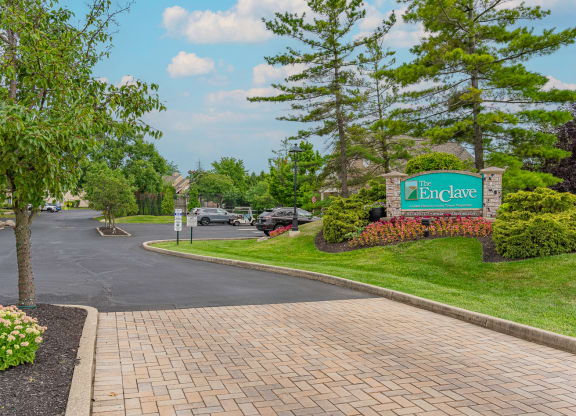 a view of the entrance sign at the enclave at woodbridge apartments in sugar land, tx at Enclave, Beavercreek, 45431