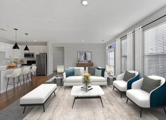 an open living room with a kitchen and dining area at Monmouth Row Apartments, Newport, KY, 41071