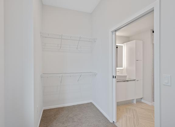 A white room with a drawing of a shelf on the wall at Sky Central Apartments, Cincinnati, OH