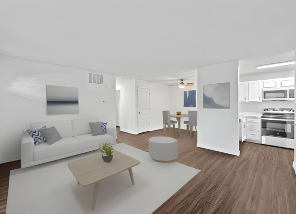 a living room with a white couch and a coffee table