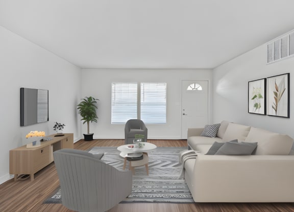 a living room with a couch and a chair and a table