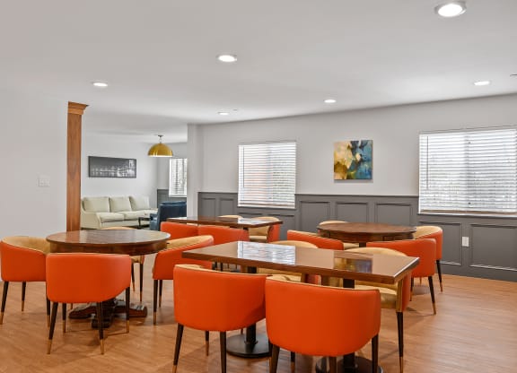 Room with a table and chairs and a couch in the background at The Valley , Cincinnati