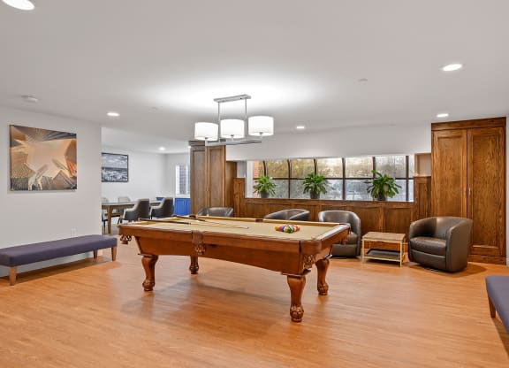 Game room with a pool table and chairs at The Valley, Cincinnati, Ohio