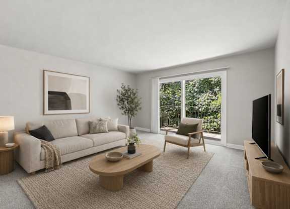 A living room with a couch, a chair, a coffee table, and a television.