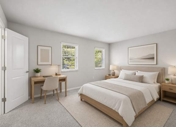 A bedroom with a bed, desk, and chair.