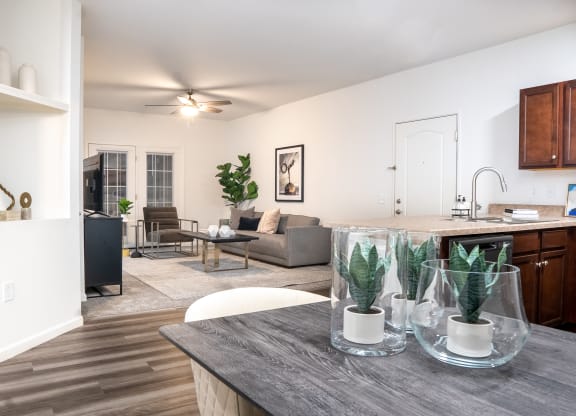 a living room and kitchen area with white walls and wood flooring at Waterstone Landing, Ohio, 43551