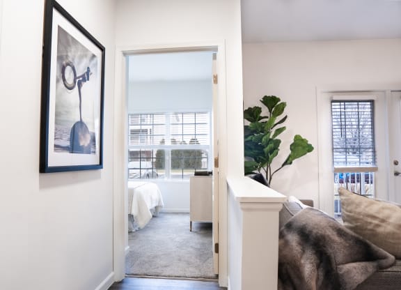 a bedroom with a large window and a door that leads to a bathroom  at Waterstone Landing, Ohio, 43551