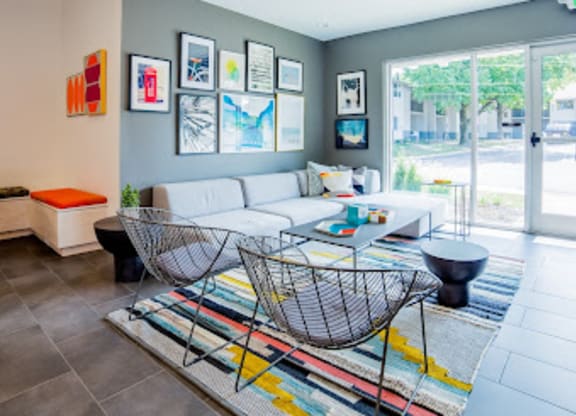 a living room filled with furniture and a large window at 7 Pointe Apartments, Indiana